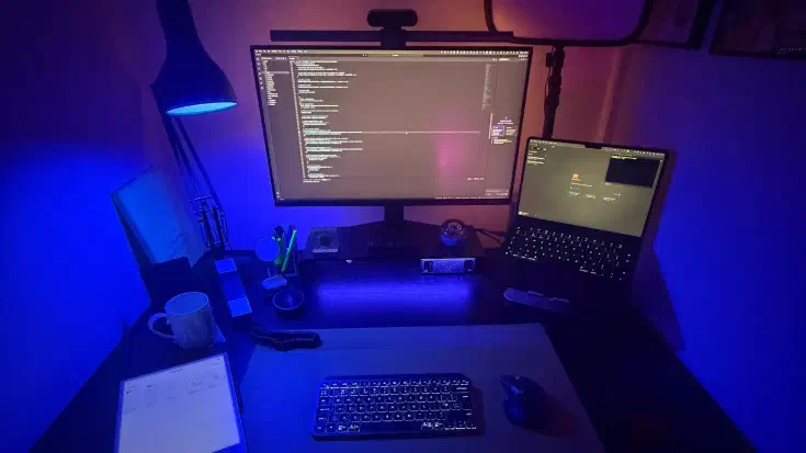 My desktop setup: reMarkable Paper Pro for ideas, MacBook Air M2, a headless NVIDIA DGX Spark handling the heavy lifting, and the tools behind the experiment — Amazon Kiro, Claude Code, and a terminal window. Plus the late-night lighting that makes it feel like coding in the 1980s again.