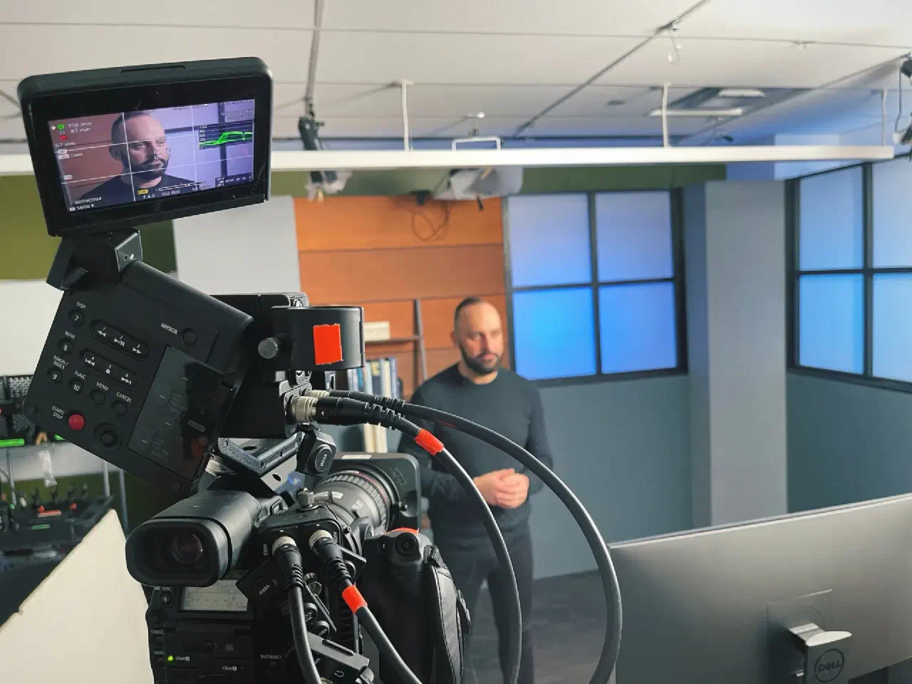 Mario Thomas framed on a broadcast camera monitor during a studio recording